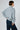 Back view of Dolci Cable Cashmere Pullover — smooth knit surface in pale blue-grey cashmere with seamless finish.