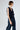Side view showing the structured silhouette and soft cable-knit texture of sustainable cashmere.