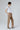 Side view of Gil Suede Trousers Grey Taupe showing soft suede drape and straight-leg cut.