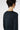 Model wearing a black long-sleeve shirt on a white background